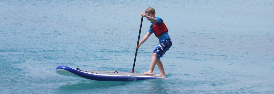 Youth stand up paddleboarding